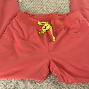 Figs coral Livingston scrub pant with neon yellow/green drawstring